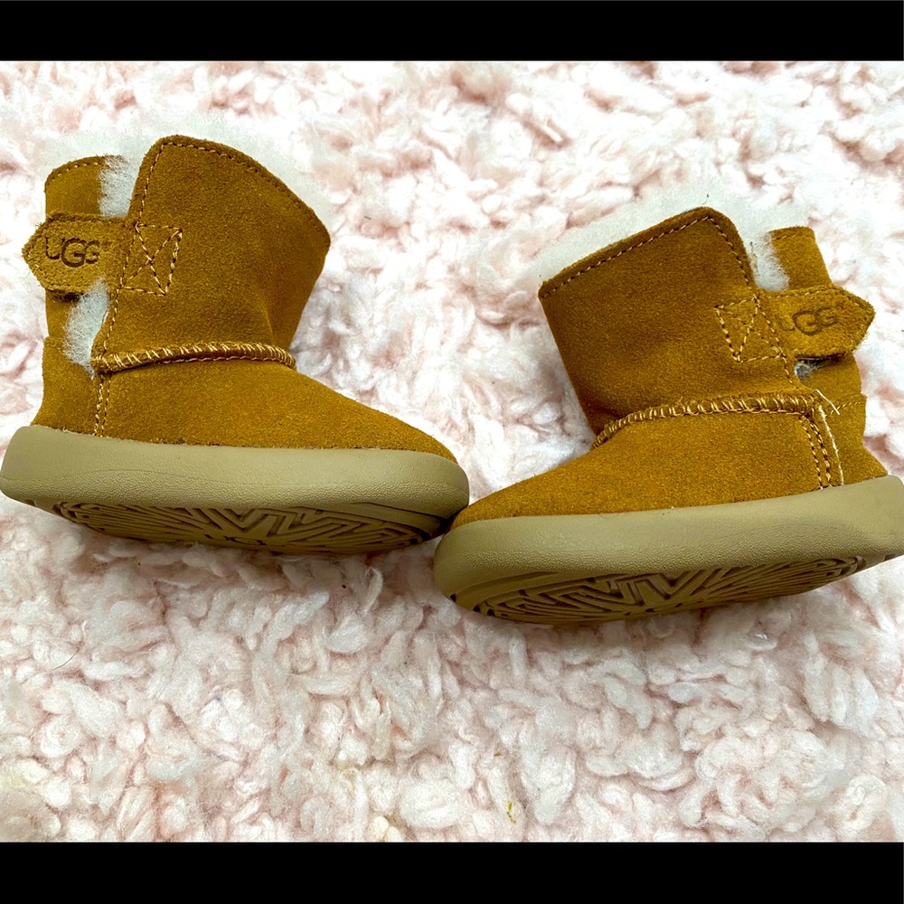 Classic, chic baby Uggs. Never worn before. Size 1